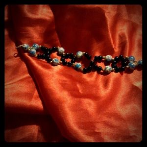 Handmade x and it's bracelets.  Can customize to t